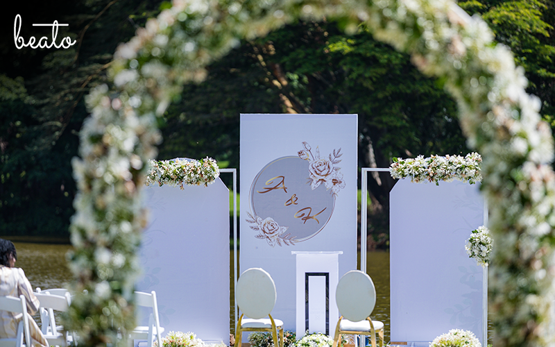 Outdoor arrangements seen through floral arch
