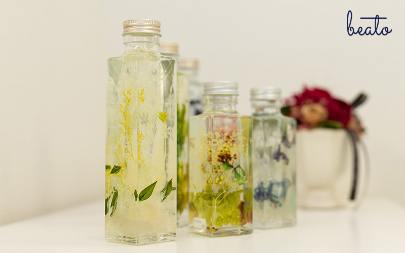 water preserved flowers in glass jars